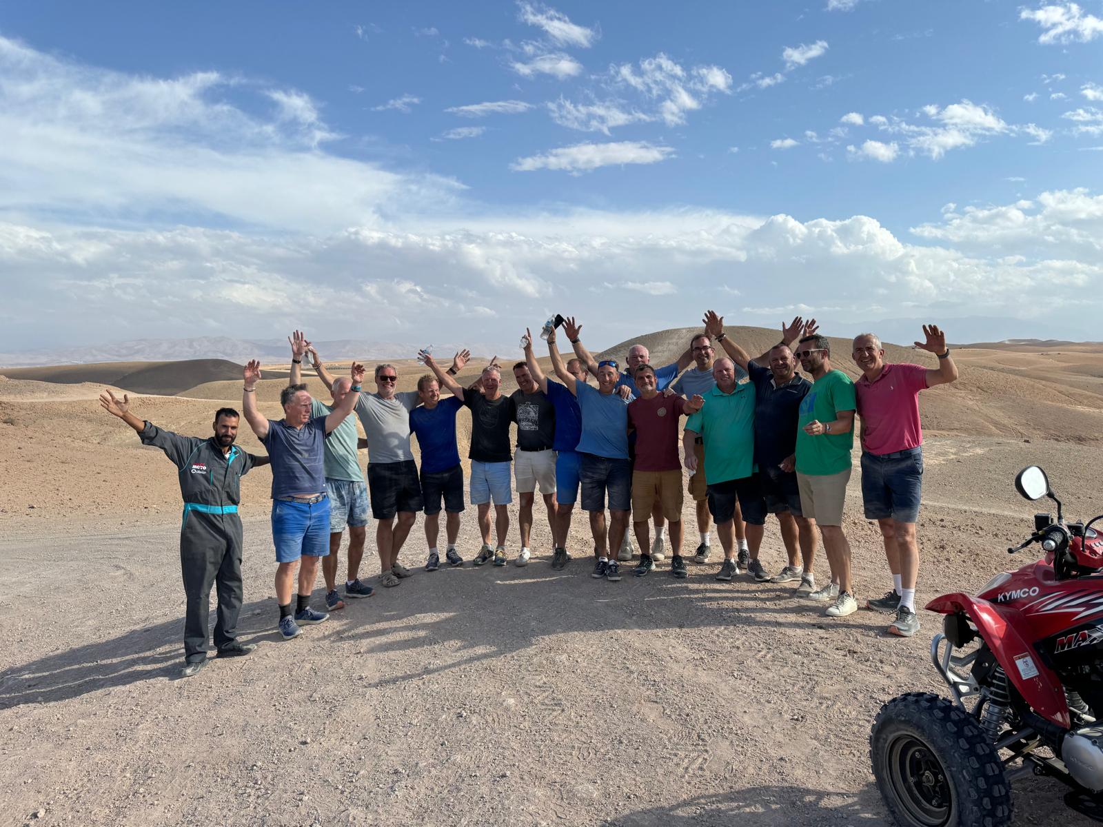 The Reloaders celebrating together in the desert