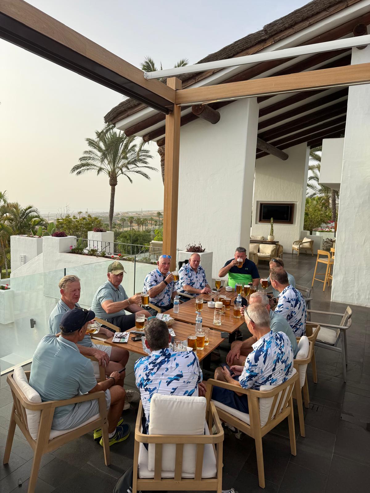 The group sharing lunch outdoors
